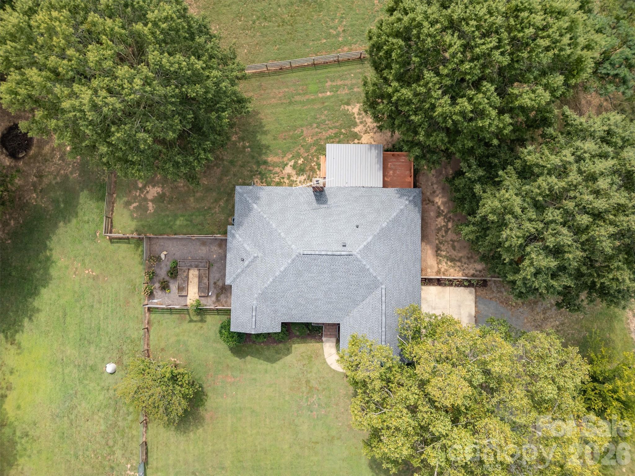 2212 Biggers Cemetery Road Monroe, NC 28110 - Photo 6 of 30 aerial view of a house with swimming pool next to a yard