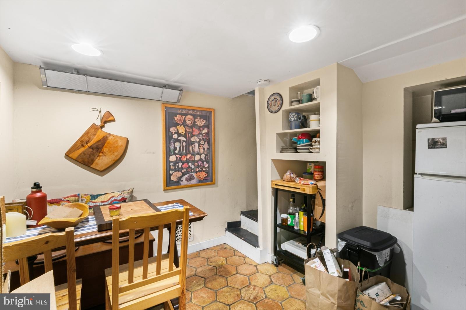 214 Monroe Street Philadelphia, PA 19147 - Photo 4 of 11 a living room with furniture a rug and a wall painting