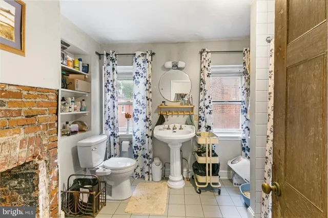 a bathroom with a toilet sink and shower