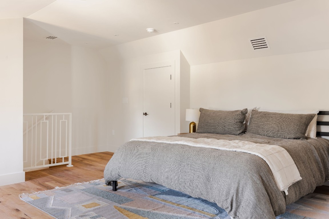 1802 Overhill Drive, Unit A Austin, TX 78721 - Photo 23 of 37 Third floor space makes an excellent second primary suite with full, attached bathroom.