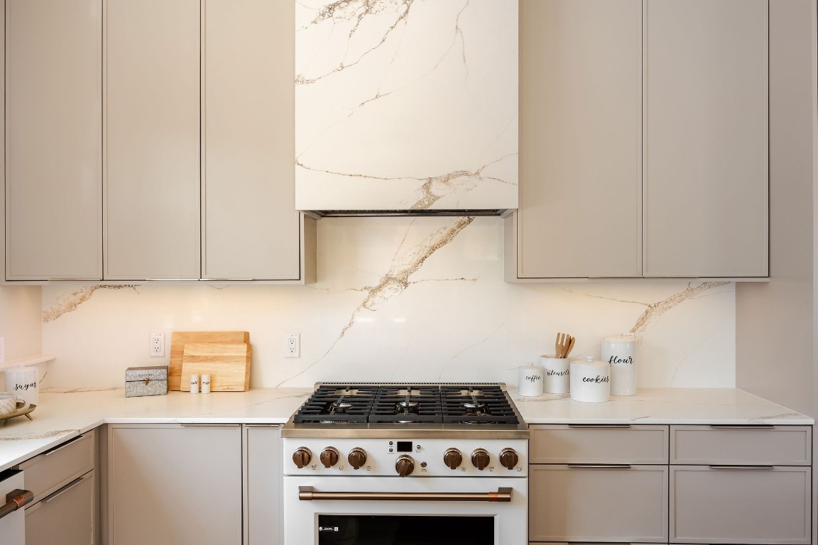 1802 Overhill Drive, Unit A Austin, TX 78721 - Photo 6 of 37 36" gas range with under-cabinet LED lighting.