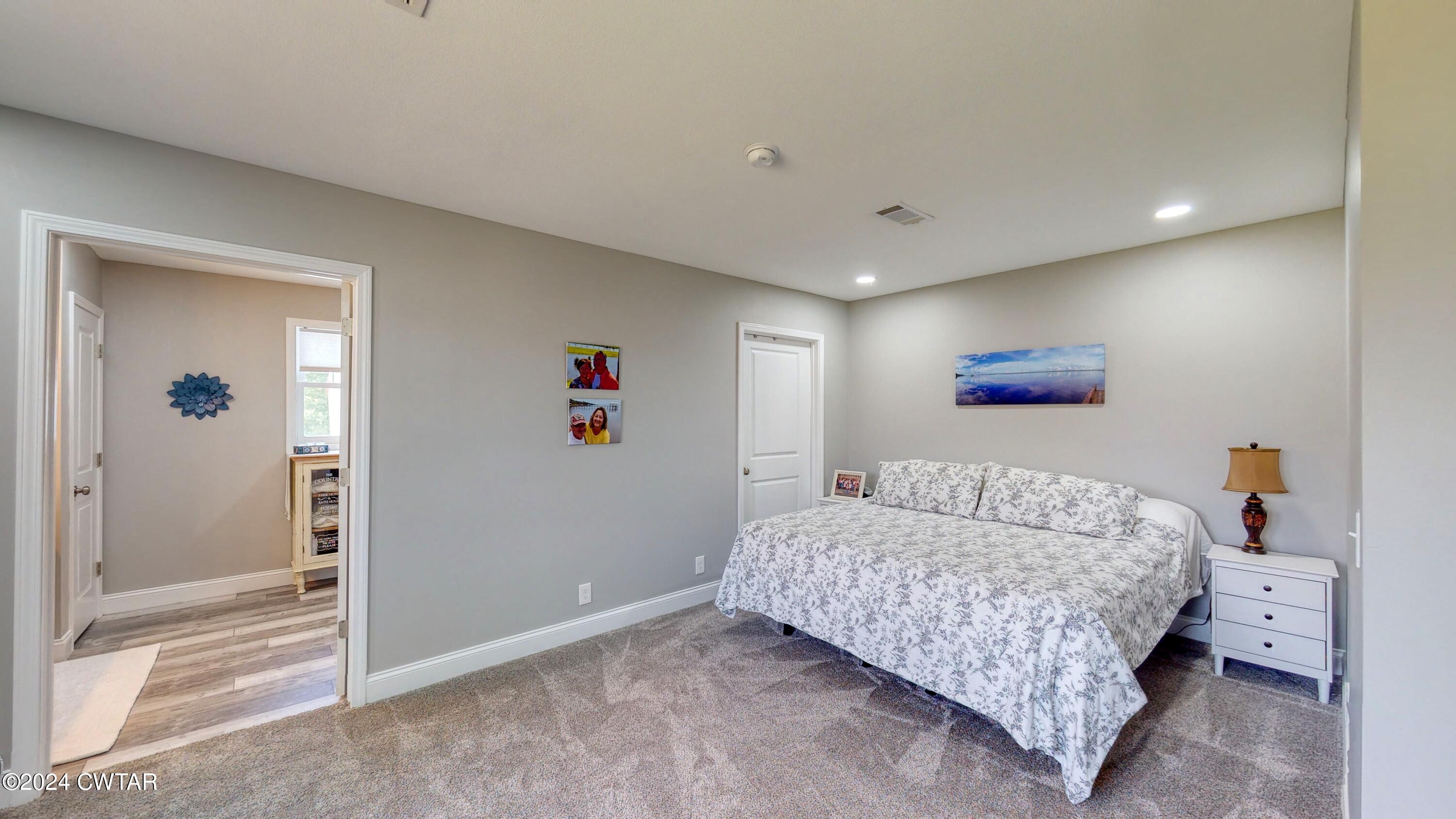2694 East Grove Road Gleason, TN 38229 - Photo 12 of 30 a bedroom with a bed and a window