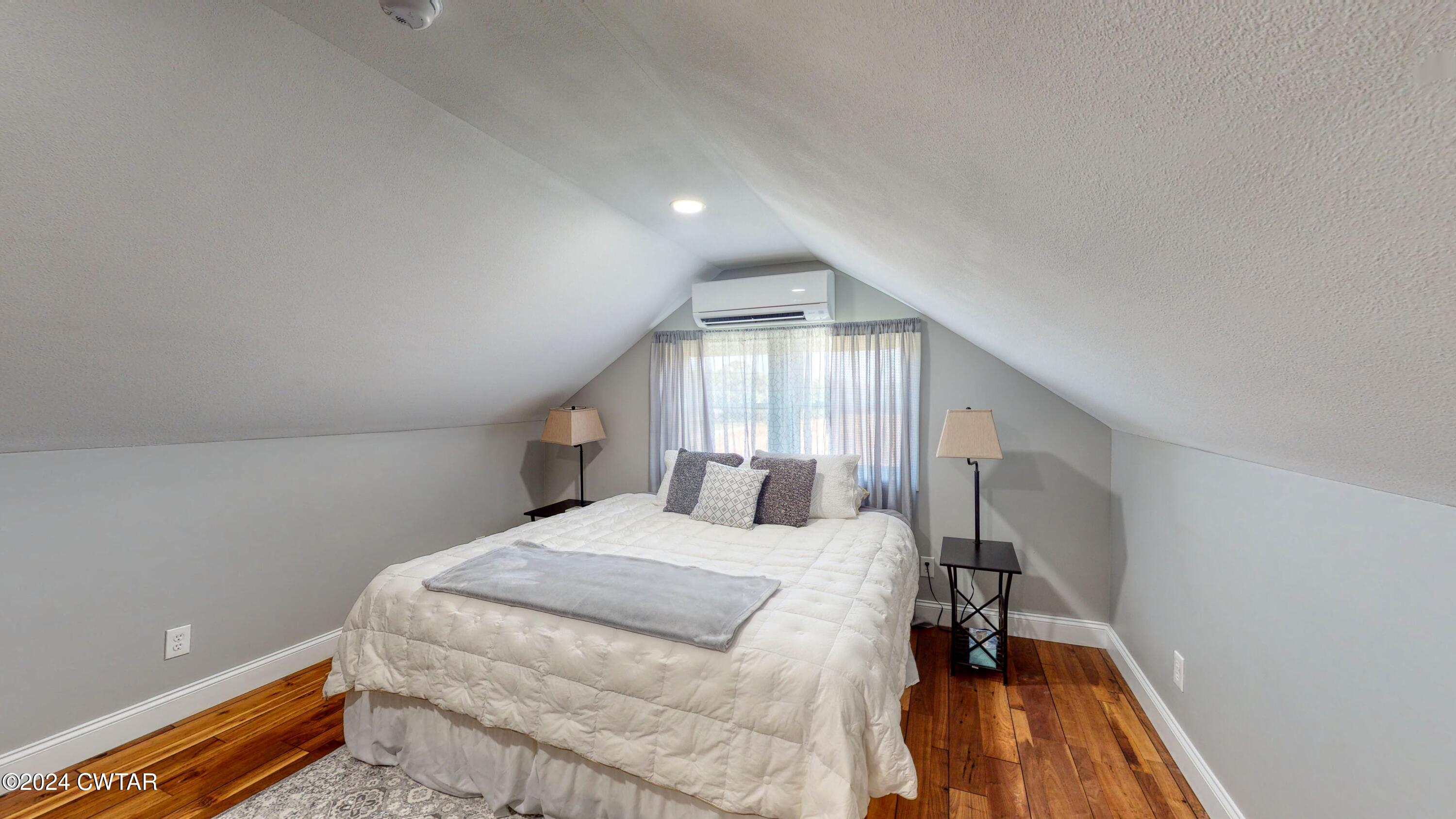 2694 East Grove Road Gleason, TN 38229 - Photo 18 of 30 a large bedroom with a bed and large windows