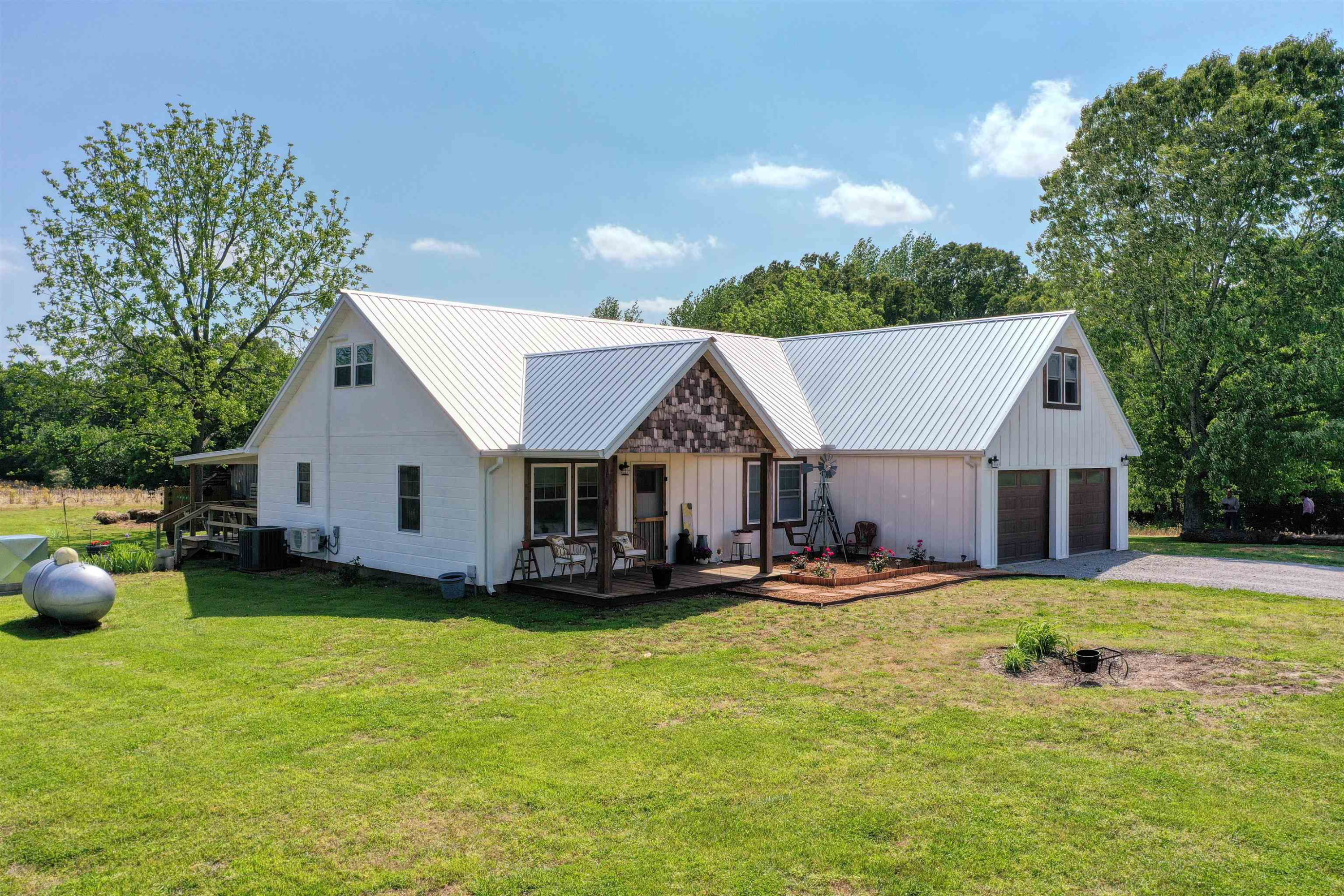 2694 East Grove Road Gleason, TN 38229 - Photo 2 of 30 a view of a house with a yard and sitting area