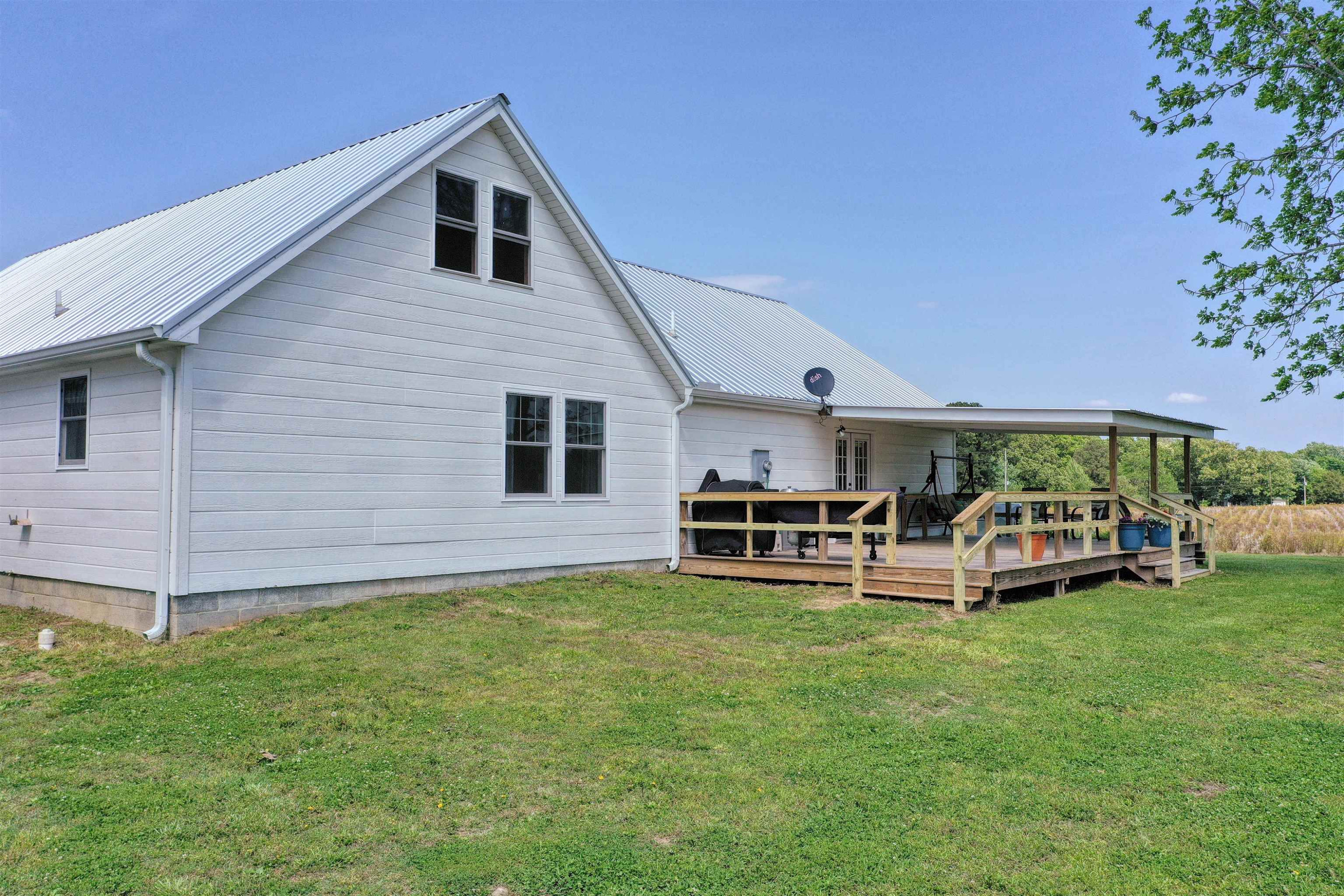 2694 East Grove Road Gleason, TN 38229 - Photo 25 of 30 a view of a house with a yard and sitting area