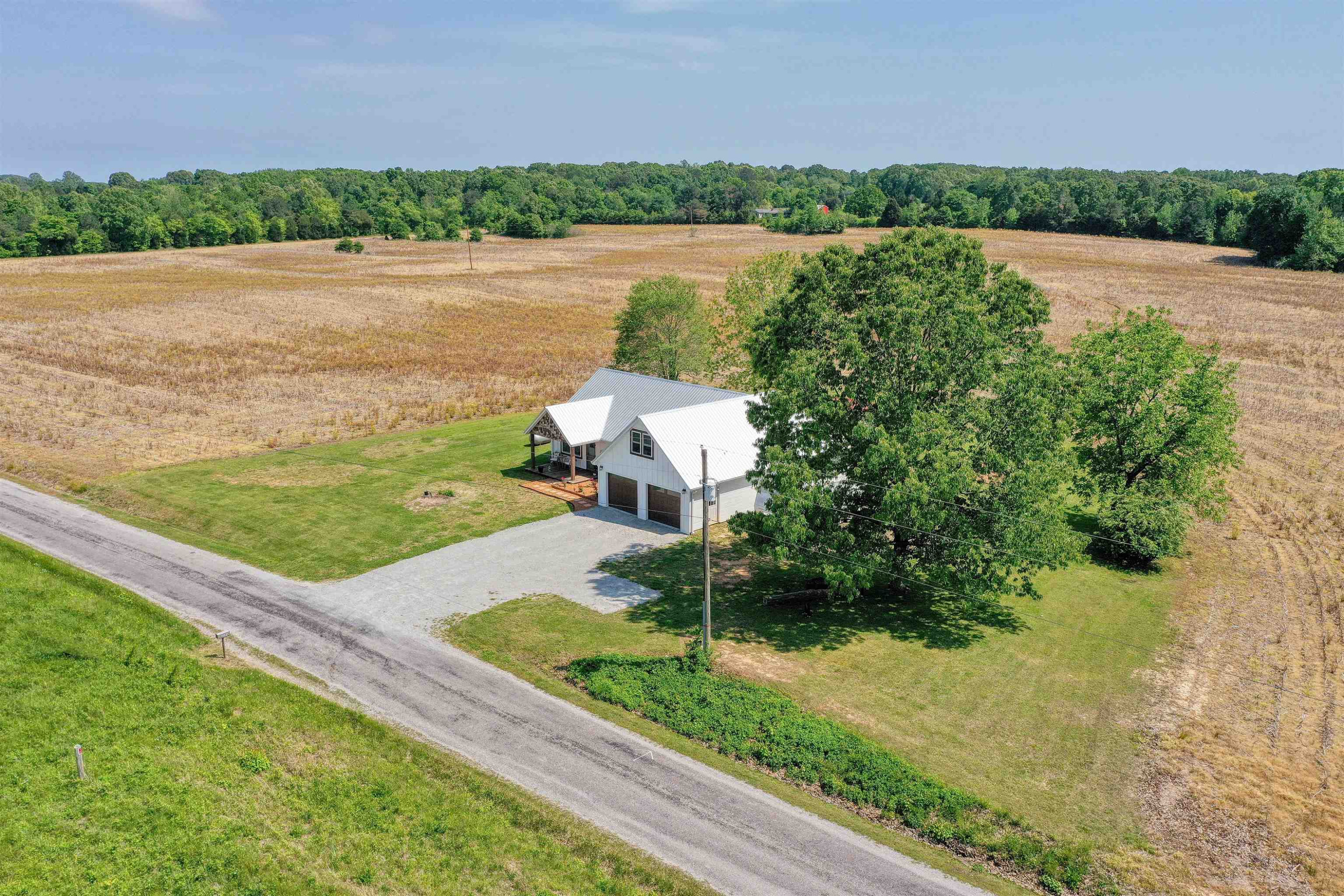 2694 East Grove Road Gleason, TN 38229 - Photo 4 of 30 a view of a lake with a yard