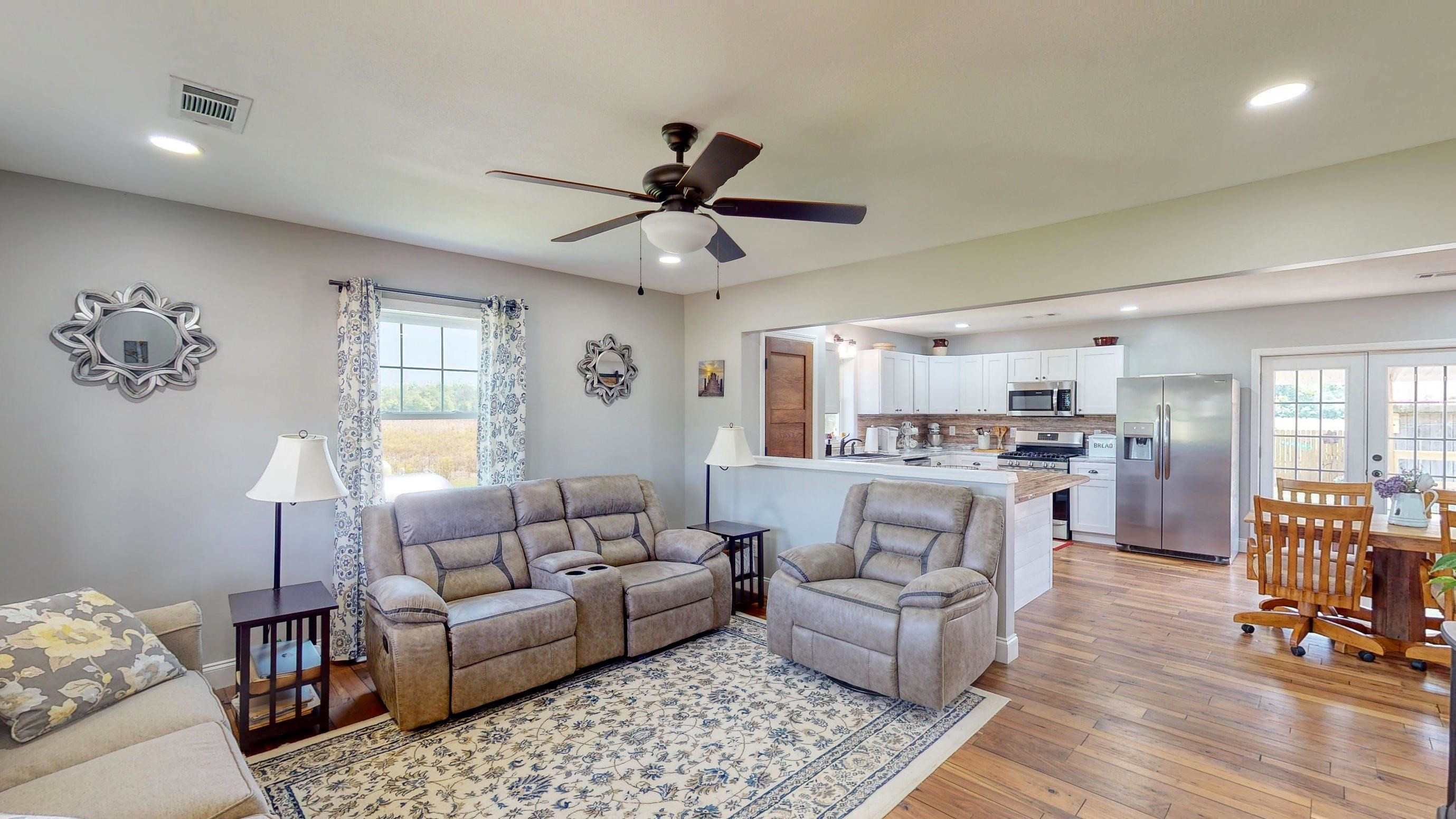 2694 East Grove Road Gleason, TN 38229 - Photo 5 of 30 a living room with furniture and a large window