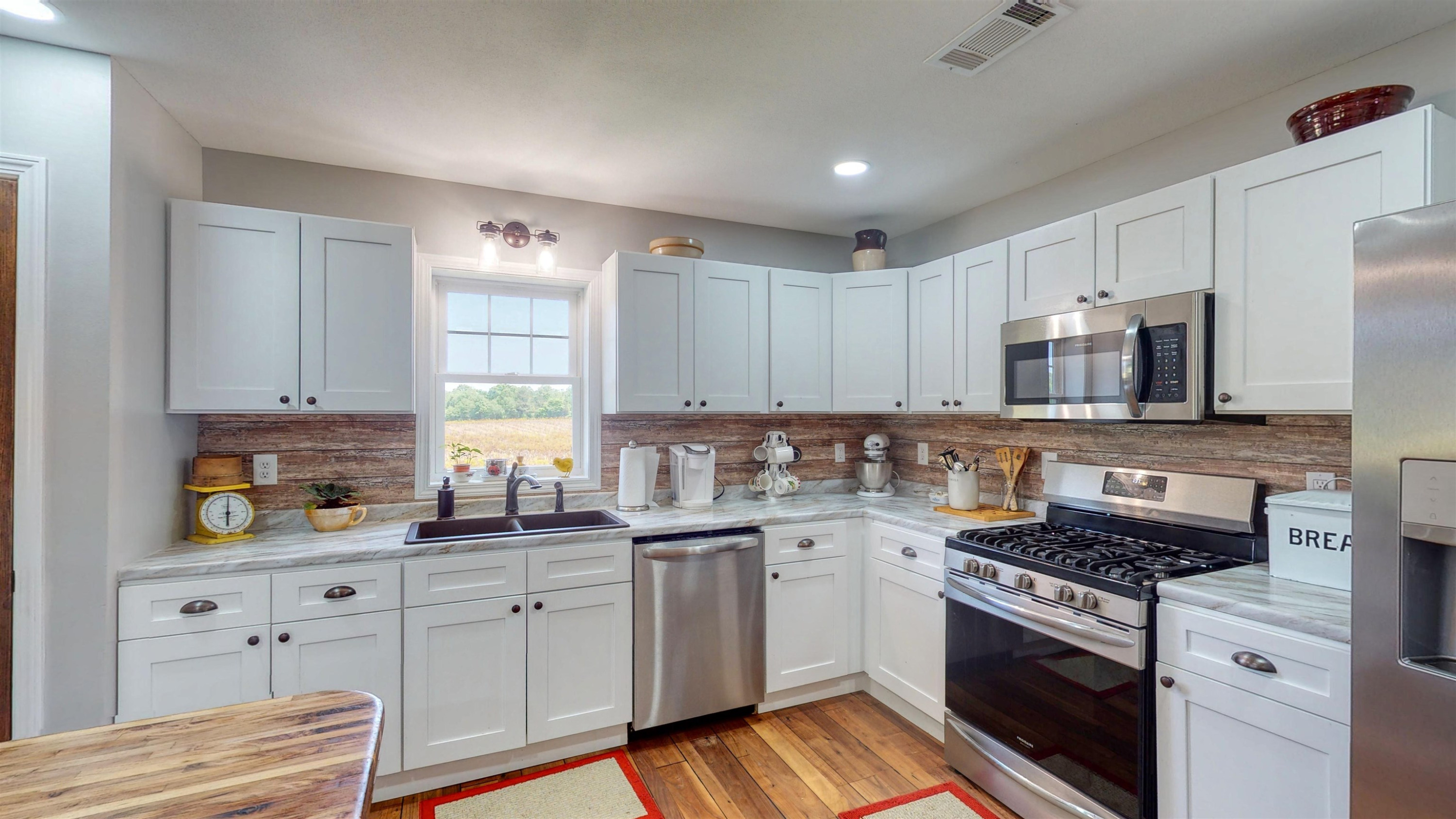 2694 East Grove Road Gleason, TN 38229 - Photo 8 of 30 a kitchen with cabinets appliances a sink and a window
