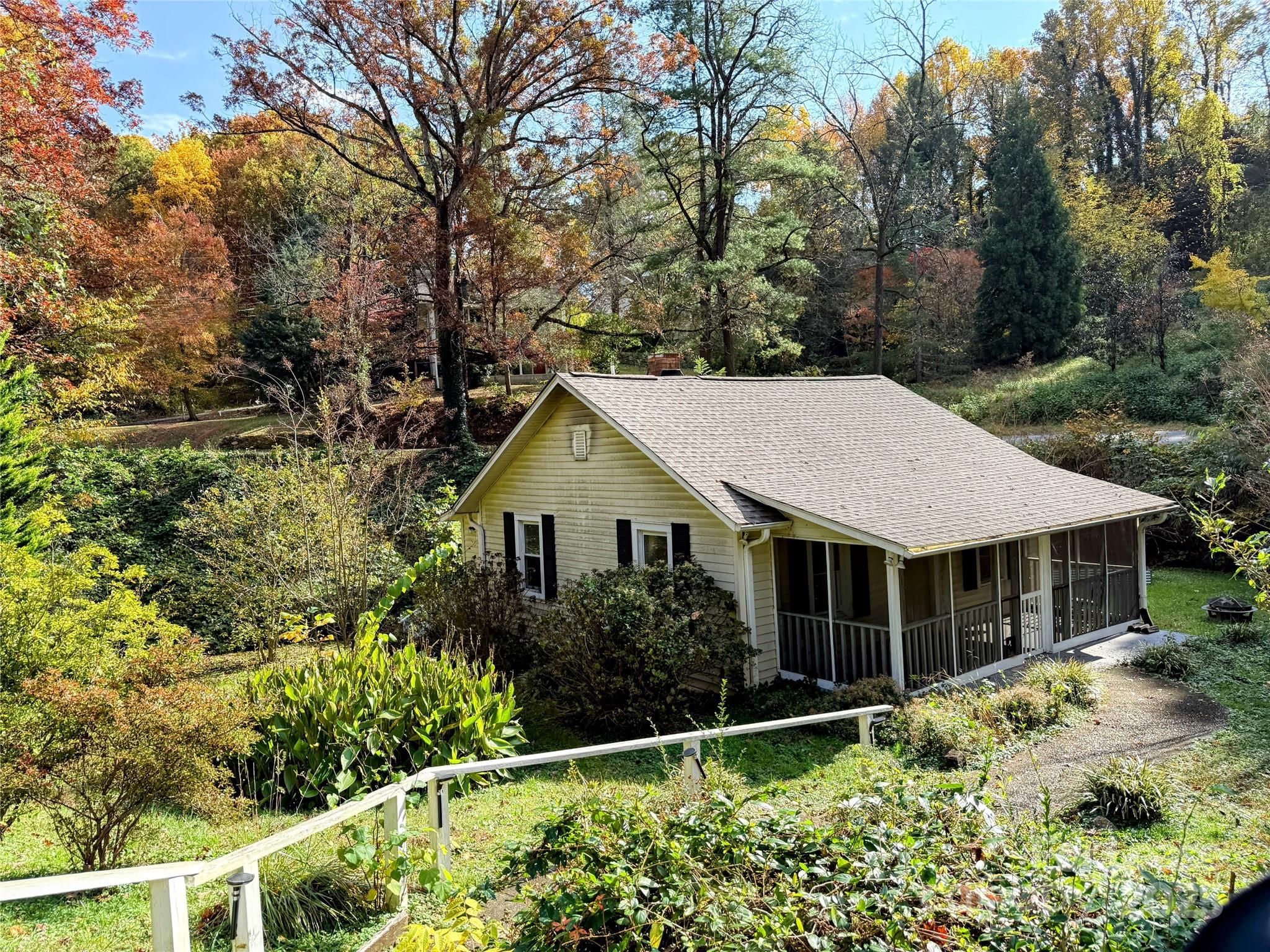 a house with trees in the background