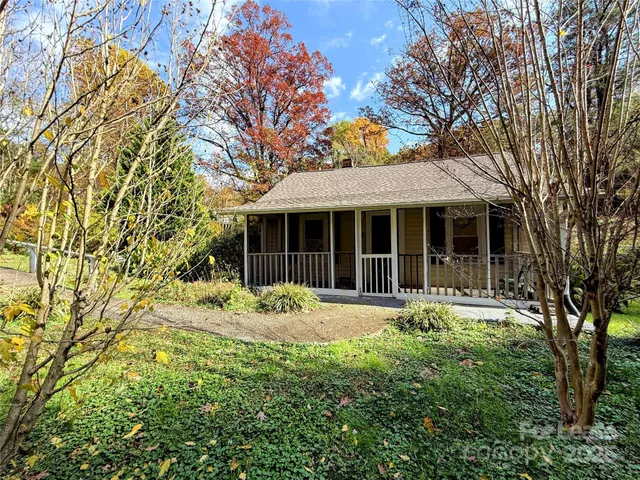 front view of a house with a garden