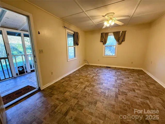 a view of an empty room with a window