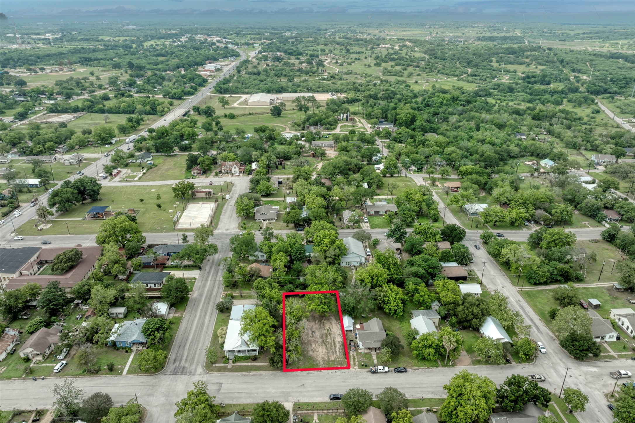 809 East Fannin Street Luling, TX 78648 - Photo 11 of 16 an aerial view of residential houses with outdoor space and trees