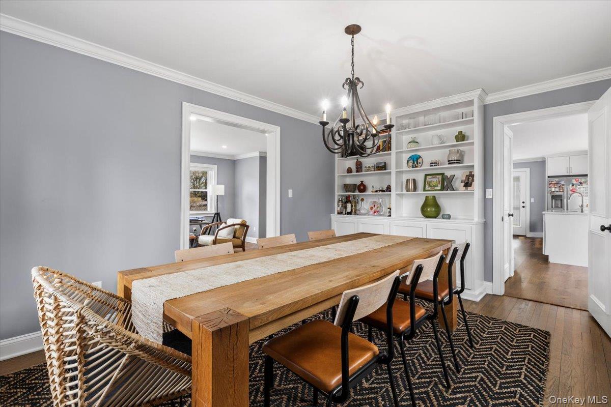 111 Spier Road Scarsdale, NY 10583 - Photo 11 of 37 a view of a dining room with furniture and chandelier