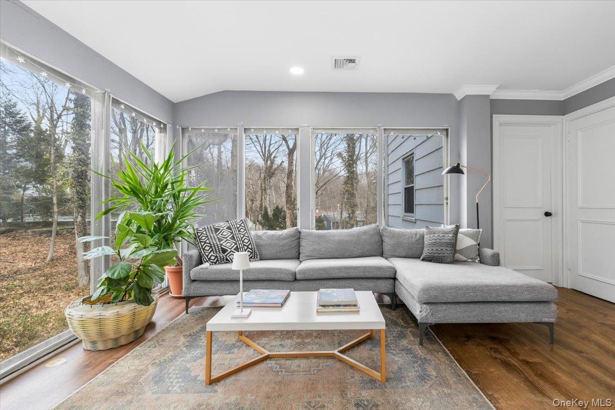 111 Spier Road Scarsdale, NY 10583 - Photo 15 of 37 a living room with furniture potted plant and a large window