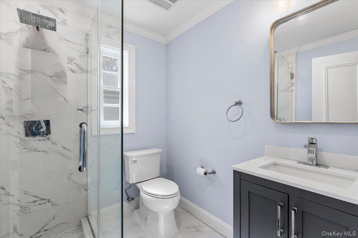111 Spier Road Scarsdale, NY 10583 - Photo 22 of 37 a bathroom with a sink a toilet and shower