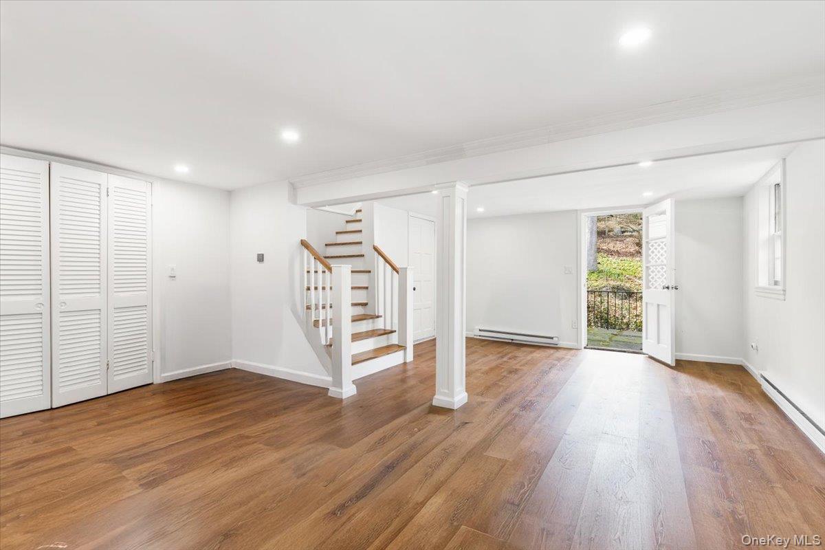 111 Spier Road Scarsdale, NY 10583 - Photo 28 of 37 an empty room with wooden floor and windows
