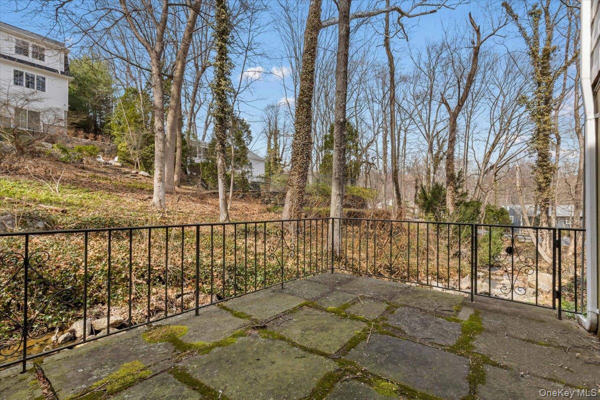111 Spier Road Scarsdale, NY 10583 - Photo 29 of 37 a view of a pathway with a wrought fence