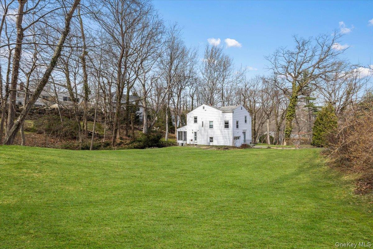 111 Spier Road Scarsdale, NY 10583 - Photo 3 of 37 a garden view with large trees