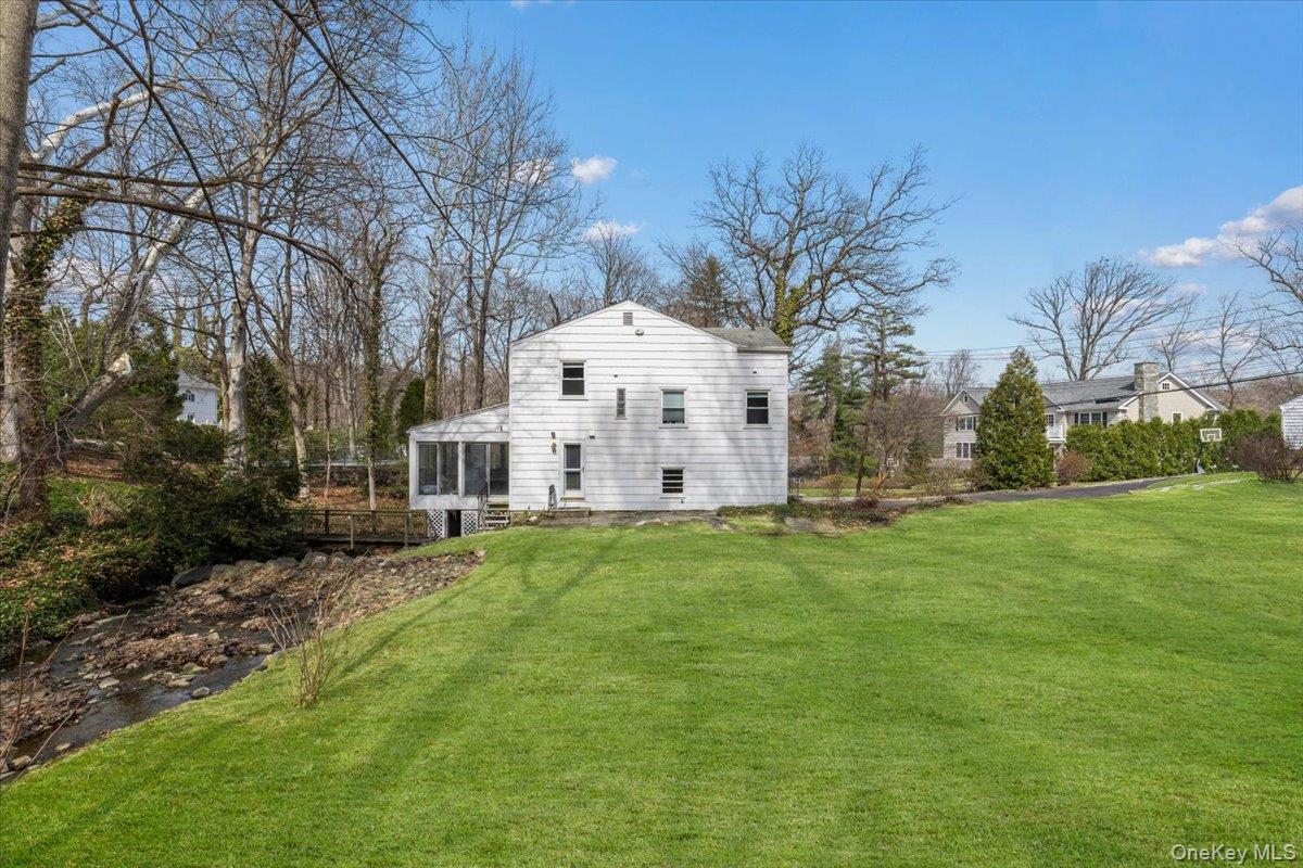 111 Spier Road Scarsdale, NY 10583 - Photo 33 of 37 a view of a house with a yard