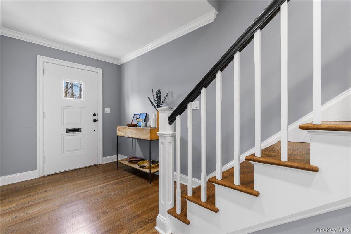 111 Spier Road Scarsdale, NY 10583 - Photo 5 of 37 a view of staircase with white walls and a window