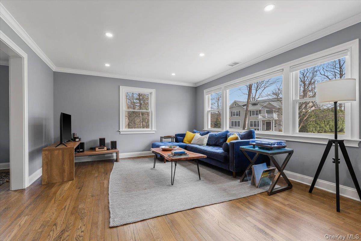 111 Spier Road Scarsdale, NY 10583 - Photo 8 of 37 a living room with furniture and a large window