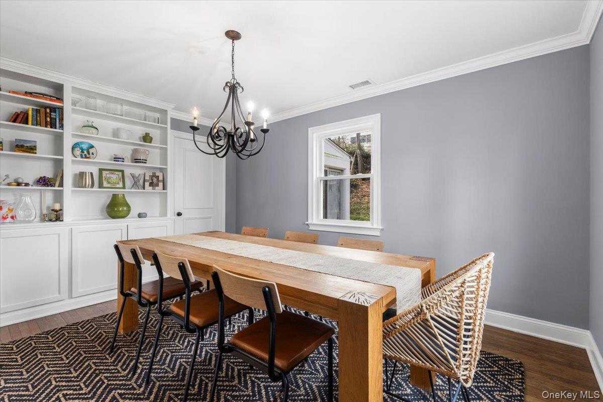 111 Spier Road Scarsdale, NY 10583 - Photo 10 of 37 a view of a dining room with furniture and chandelier