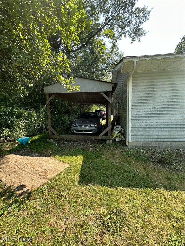 15528 Stoltz Road Diamond, OH 44412 - Photo 25 of 28 View of yard featuring a carport