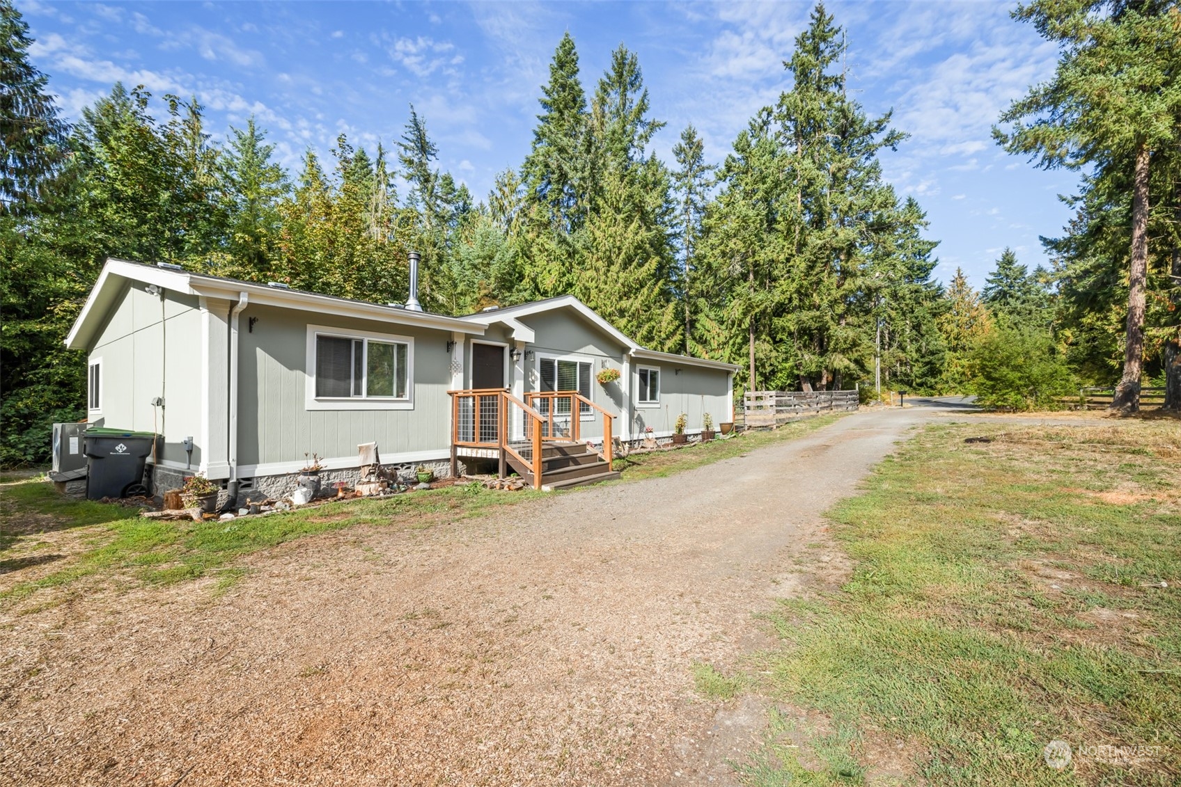 4982 Happy Valley Road Sequim, WA 98382 - Photo 1 of 40 a view of a house with backyard and sitting area