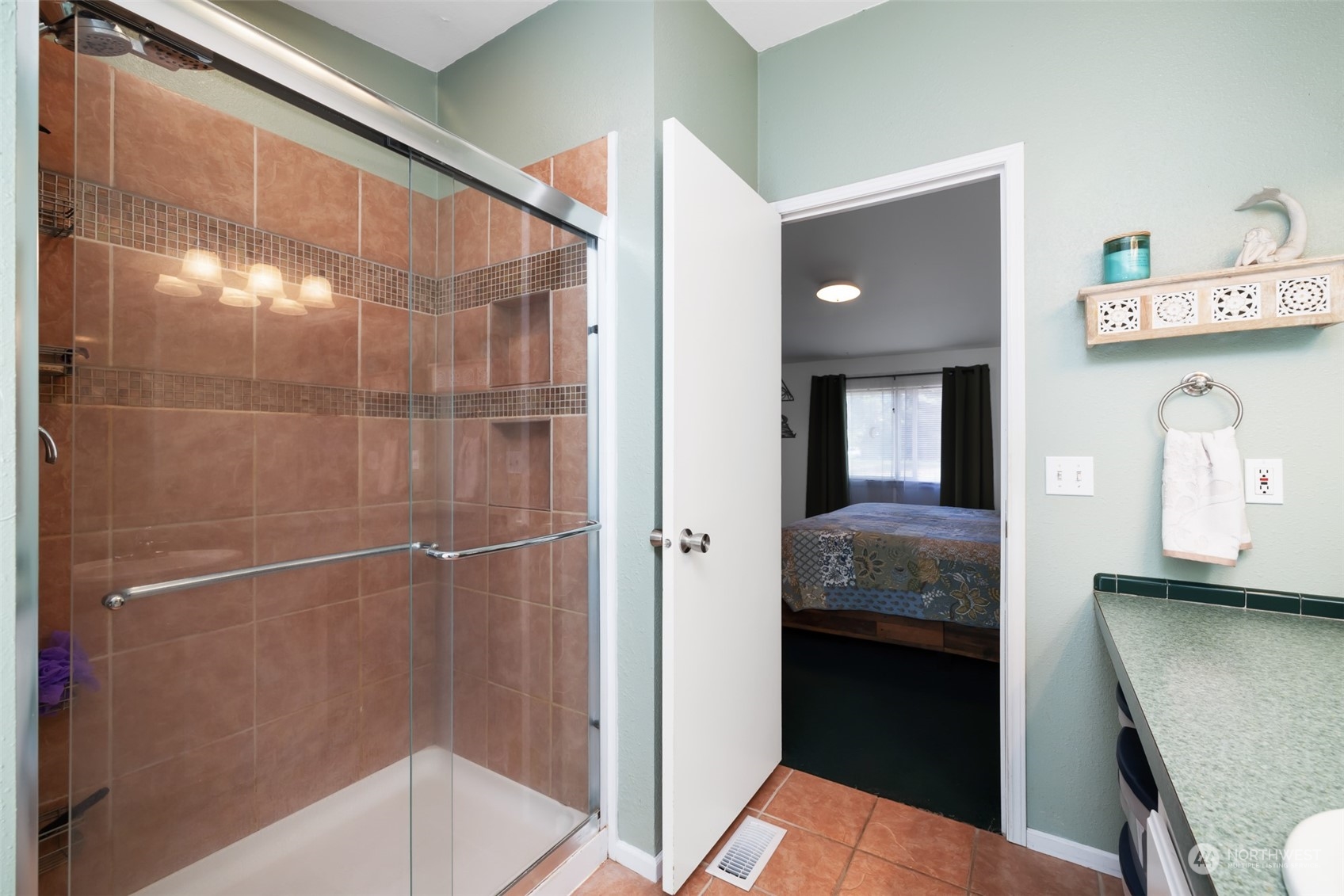 4982 Happy Valley Road Sequim, WA 98382 - Photo 19 of 40 a en suite bathroom with a granite countertop sink and a mirror