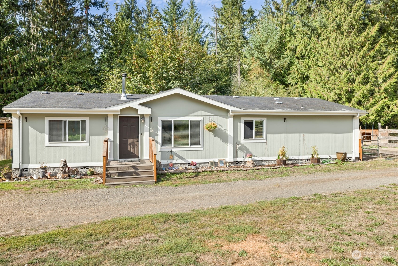 4982 Happy Valley Road Sequim, WA 98382 - Photo 2 of 40 a front view of a house with a yard