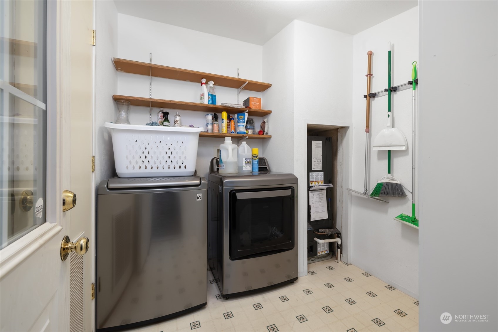 4982 Happy Valley Road Sequim, WA 98382 - Photo 24 of 40 a kitchen with stainless steel appliances a refrigerator and cabinets