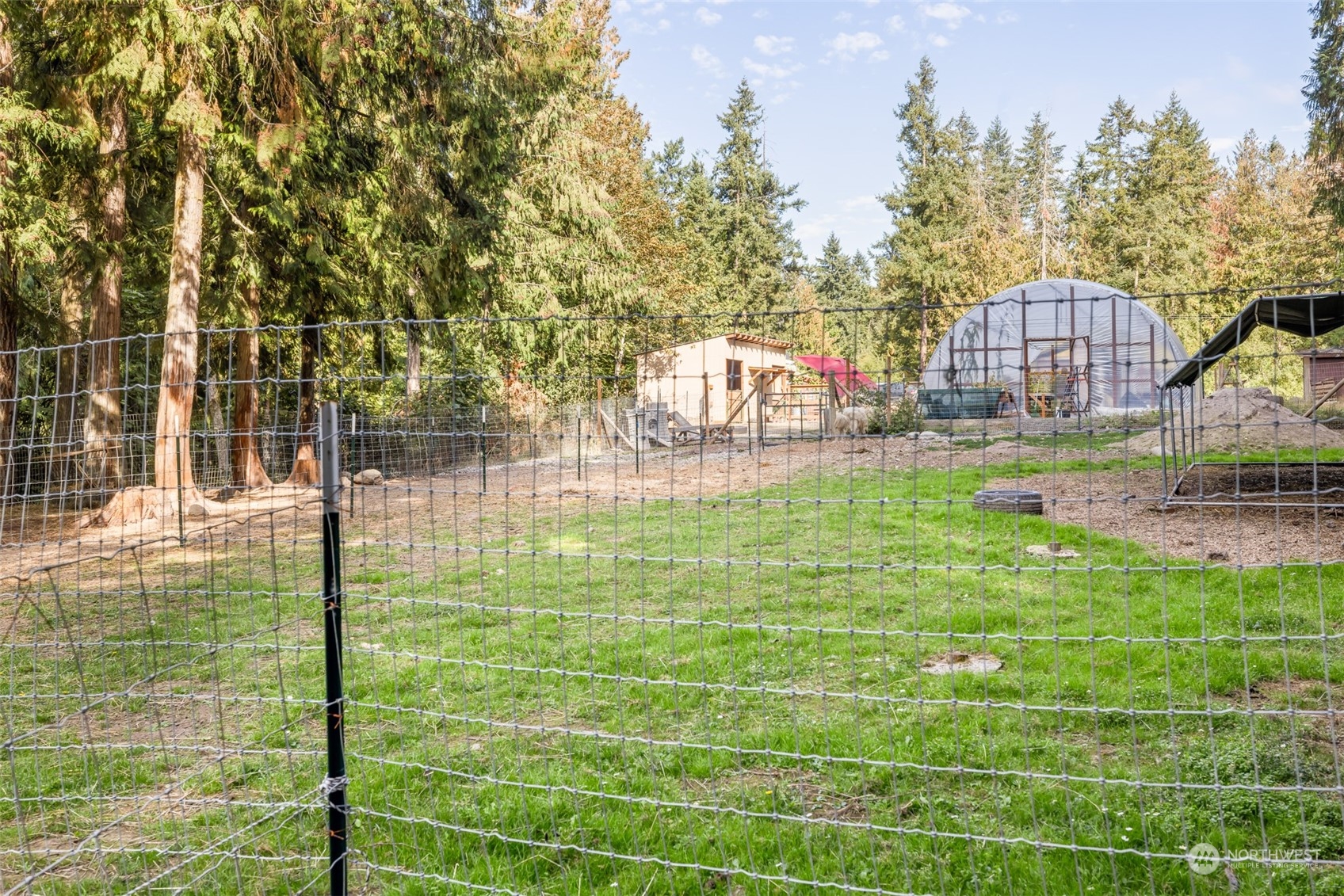 4982 Happy Valley Road Sequim, WA 98382 - Photo 31 of 40 a backyard of a house with lots of green space