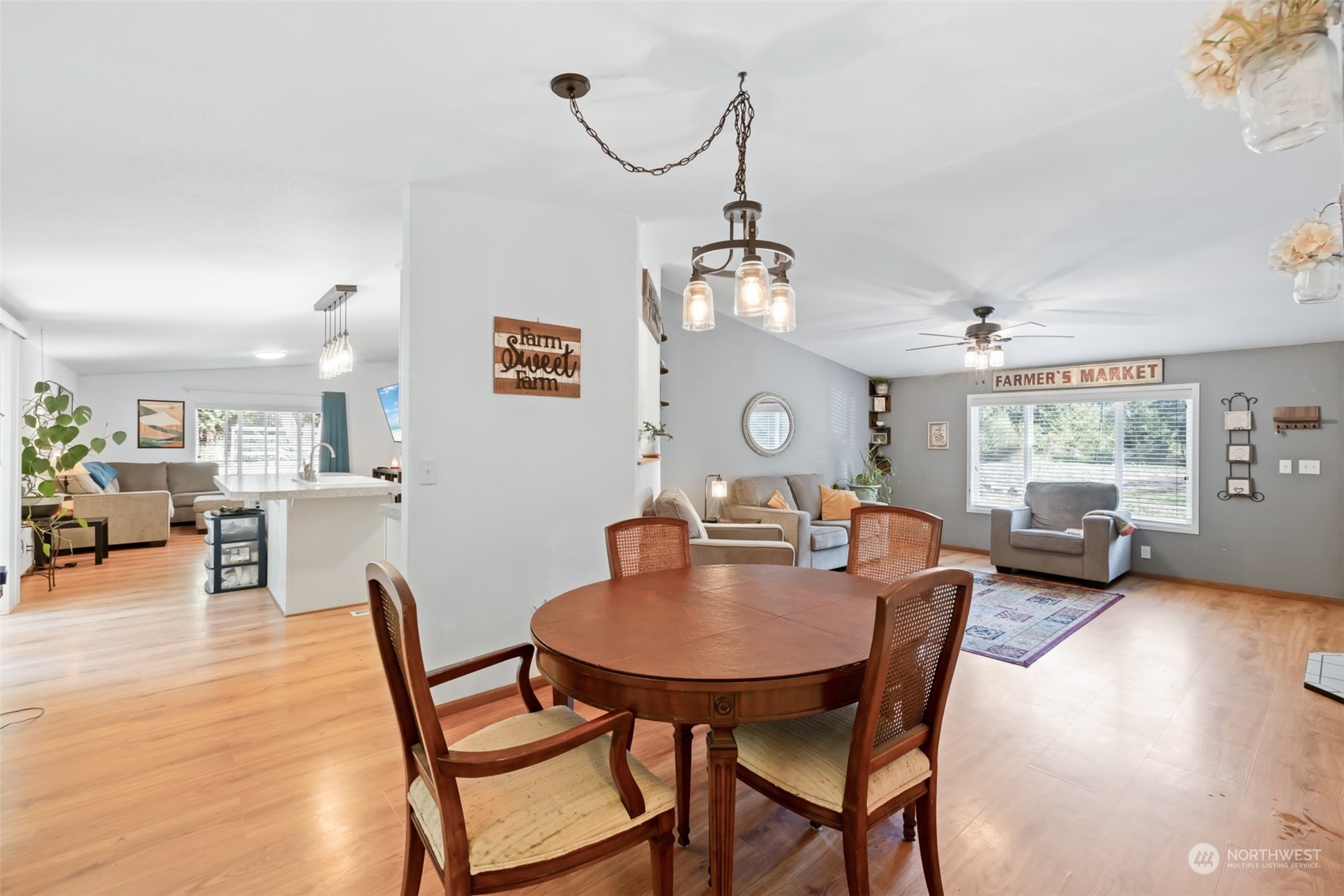 4982 Happy Valley Road Sequim, WA 98382 - Photo 6 of 40 a view of a dining room with furniture window and wooden floor