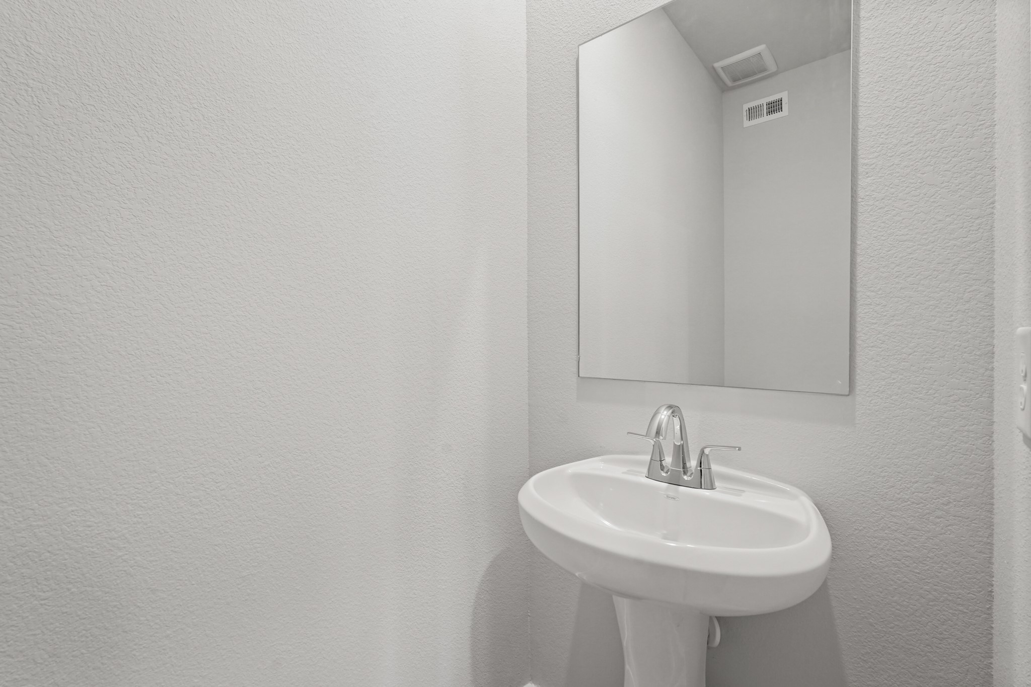 217 Spring Drive Hockley, TX 77447 - Photo 9 of 27 a bathroom with a sink and a mirror