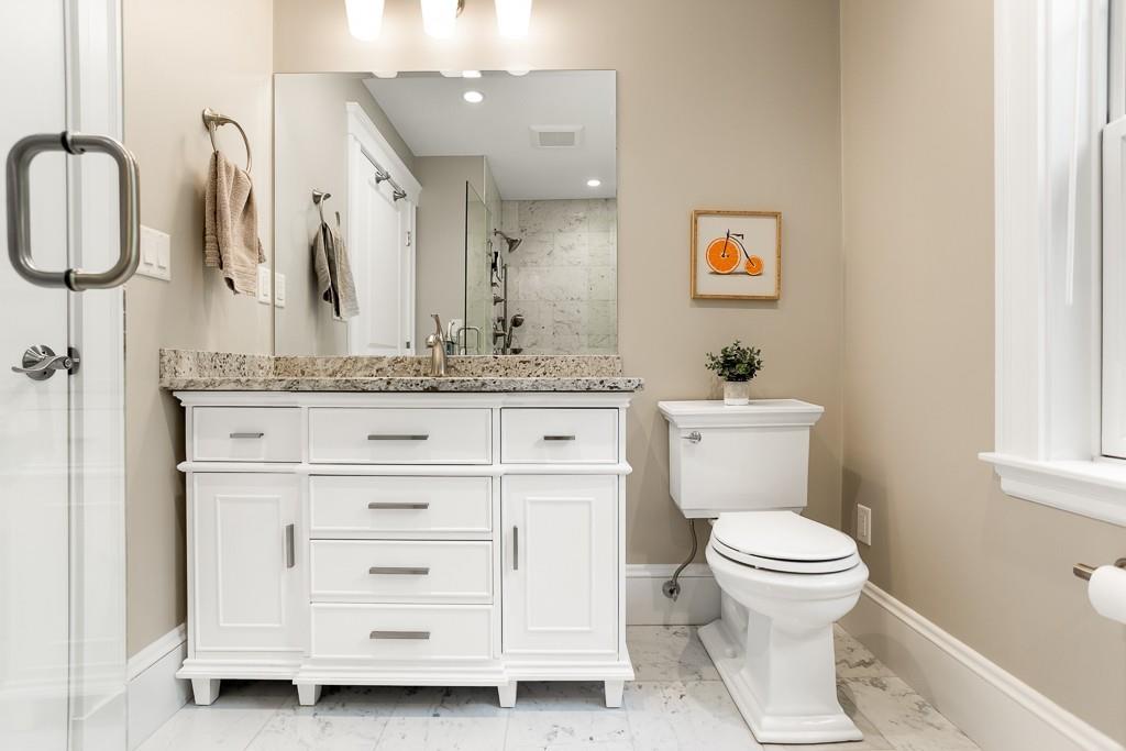 98 Middlesex Street Winchester, MA 01890 - Photo 17 of 35 a bathroom with a sink a toilet and a mirror