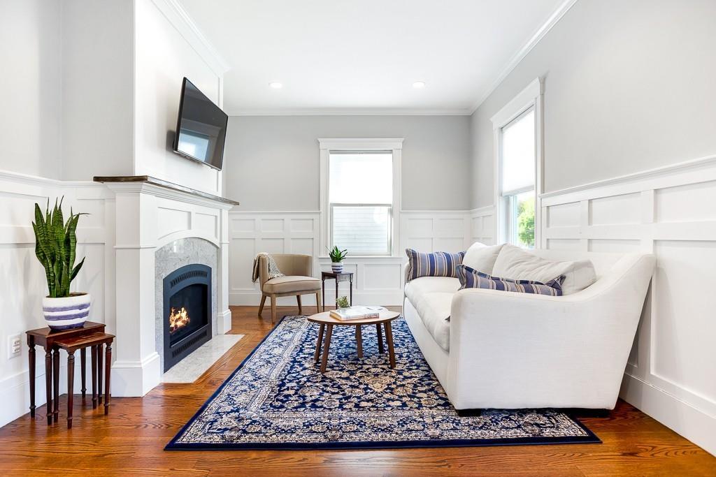 98 Middlesex Street Winchester, MA 01890 - Photo 2 of 35 a living room with furniture and a fireplace
