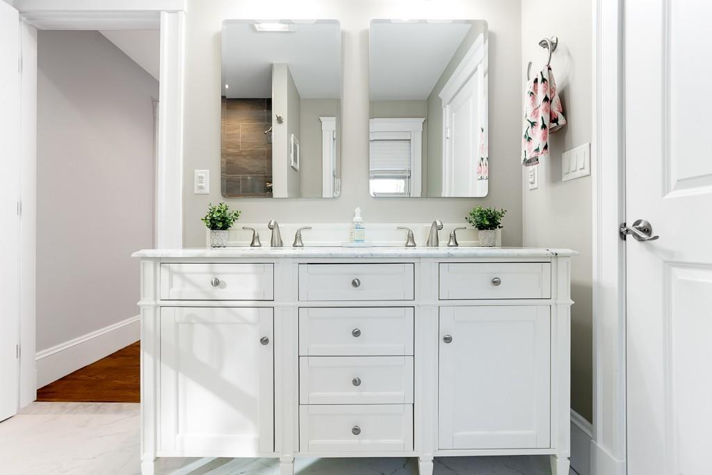 98 Middlesex Street Winchester, MA 01890 - Photo 22 of 35 a bathroom with a sink vanity and a mirror