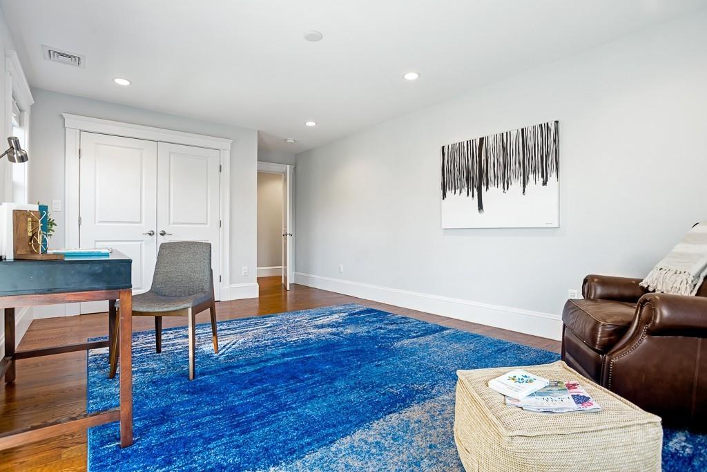 98 Middlesex Street Winchester, MA 01890 - Photo 25 of 35 a living room with furniture and a wooden floor
