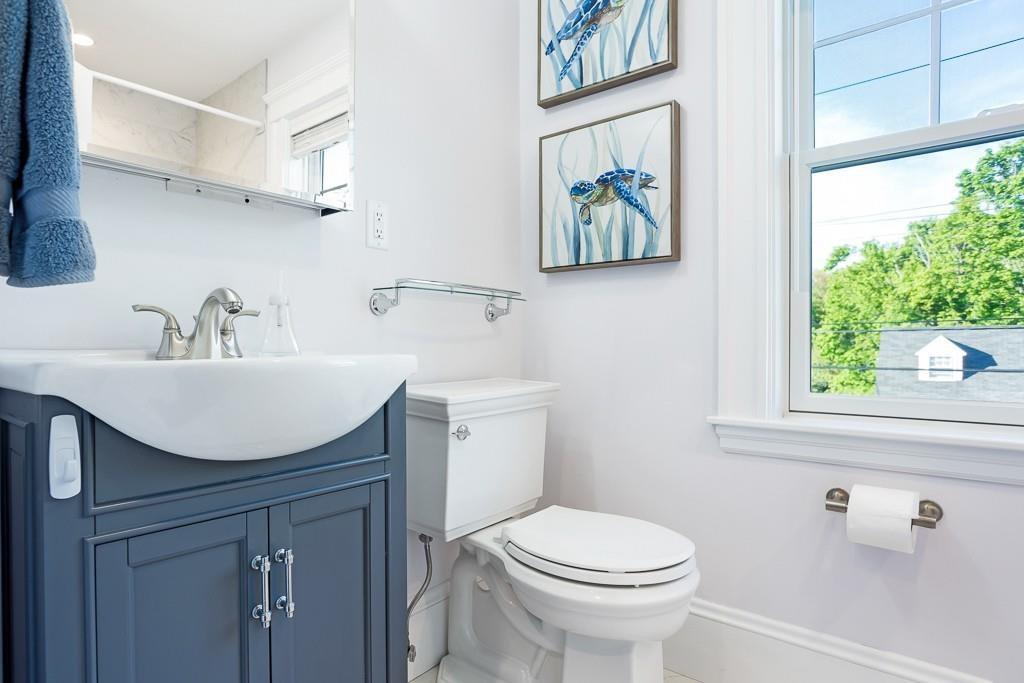 98 Middlesex Street Winchester, MA 01890 - Photo 26 of 35 a bathroom with a sink a toilet and a window