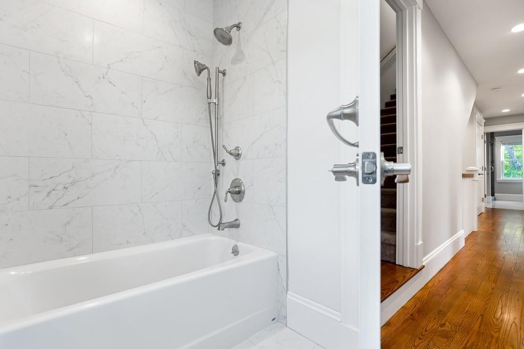 98 Middlesex Street Winchester, MA 01890 - Photo 27 of 35 a bathroom with a bathtub a shower and a bath tub