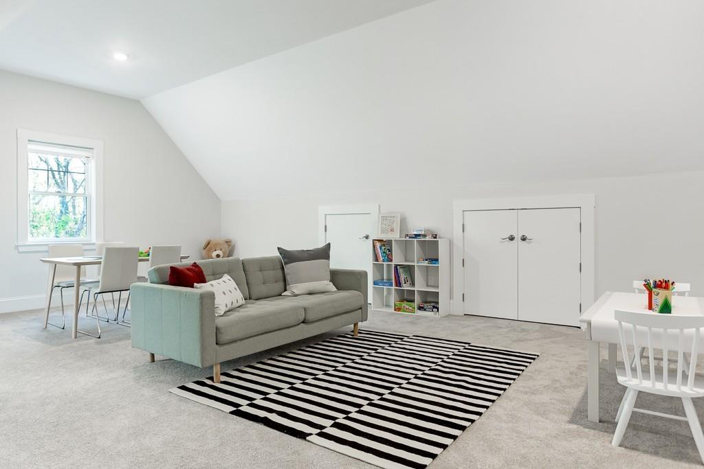 98 Middlesex Street Winchester, MA 01890 - Photo 29 of 35 a living room with furniture a window and a table