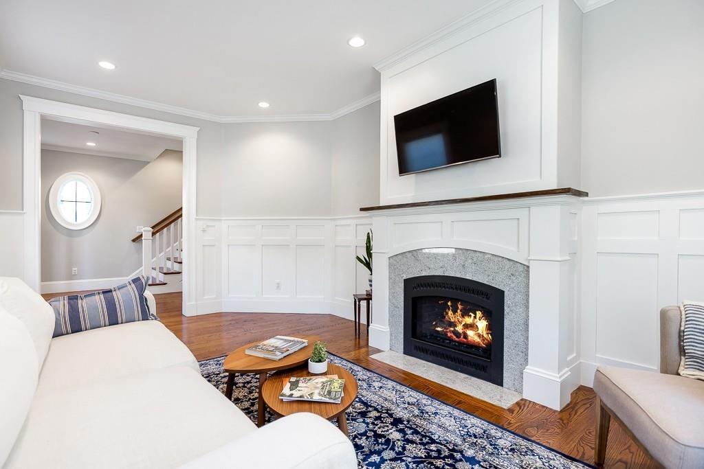 98 Middlesex Street Winchester, MA 01890 - Photo 3 of 35 a living room with furniture and a fireplace