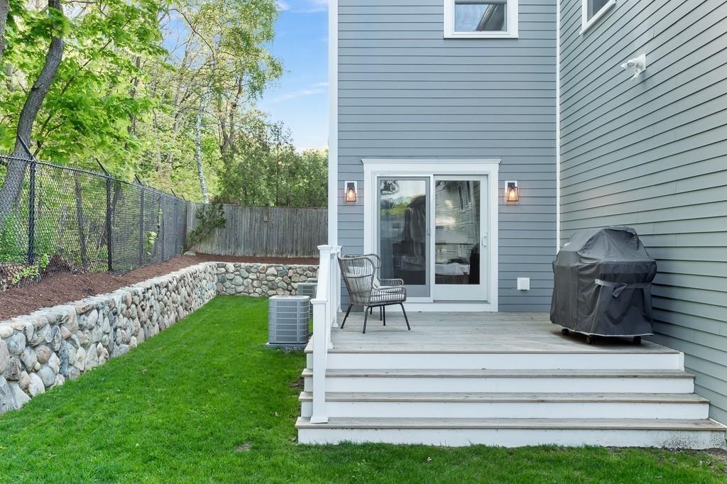 98 Middlesex Street Winchester, MA 01890 - Photo 35 of 35 a view of a chair and table in backyard of the house
