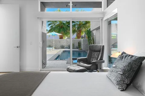 a bathroom with a double vanity sink mirror and shower