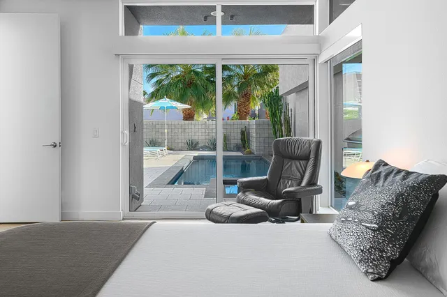 a bathroom with a double vanity sink mirror and shower