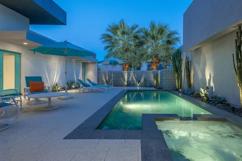 a living room with fireplace furniture and a wooden floor