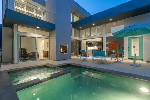 a room with furniture and a potted plant