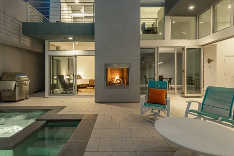 swimming pool view with a seating space