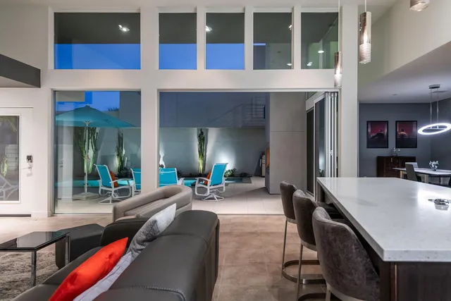 a view of a street with palm trees