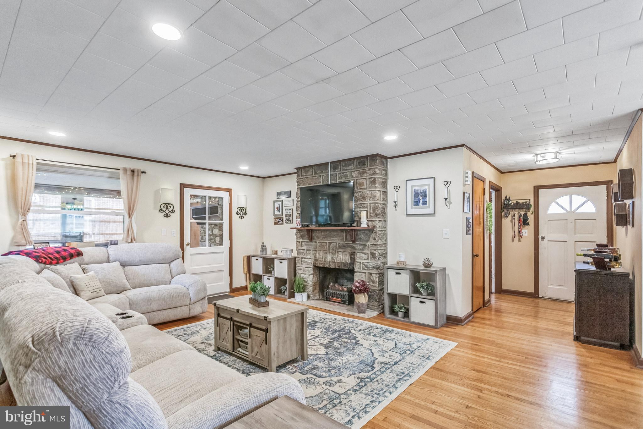 Living room with wood fireplace.